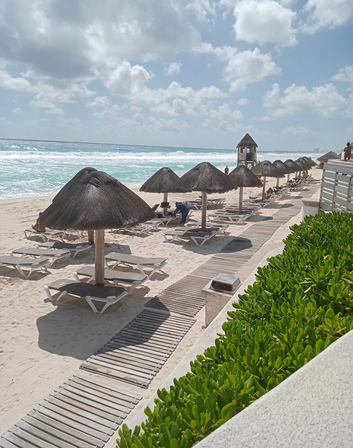 A view of the beautiful beaches at Cancun with chaise lounges from Grosfillex