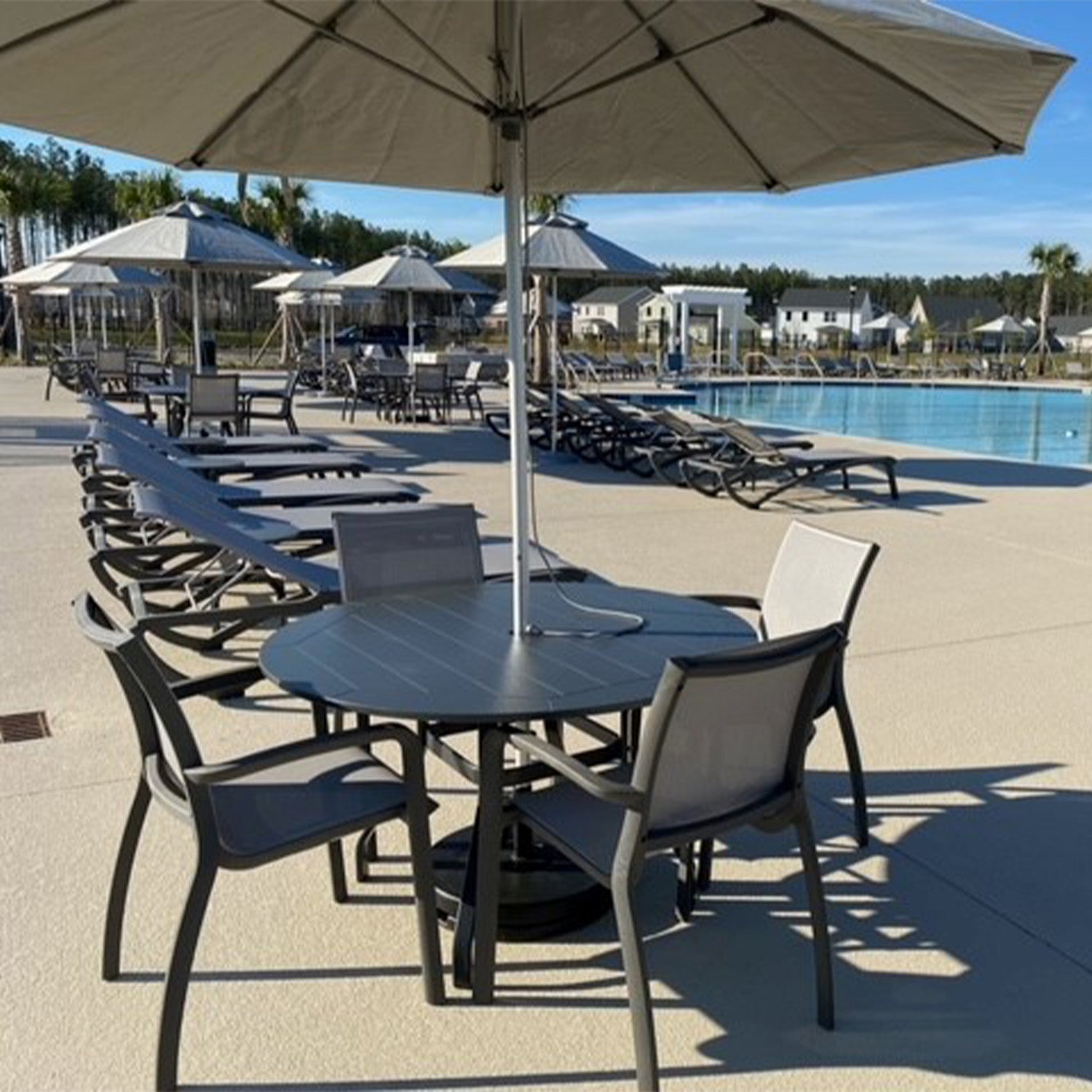 Sunset Armchairs being used for dining by the pool at Watson Hill HOA